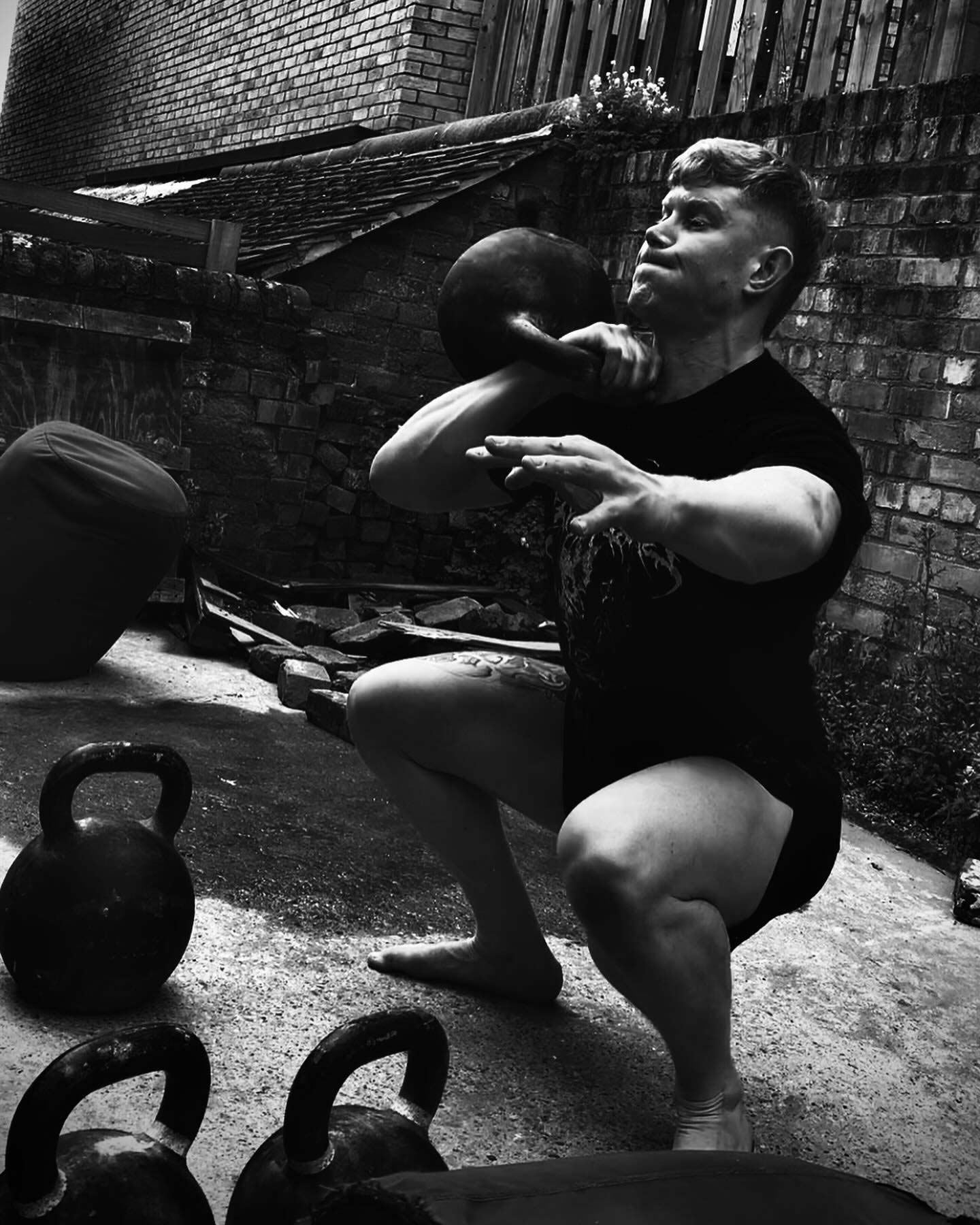 Coach lifting weights during a workout.